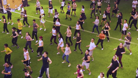 A-Group-of-People-are-Dancing-Together-on-the-Grass-Carpet