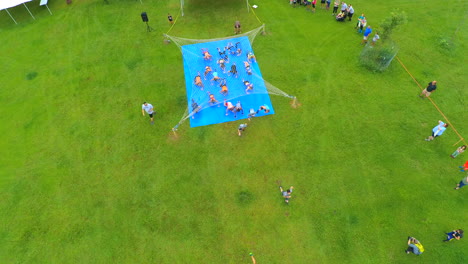 Drone-shot-of-athletes-at-a-Mud-Run-starting-line