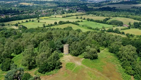 Aerial-hyper-lapse-moving-round-a-folly-on-top-of-a-hill-in-the-English-countryside