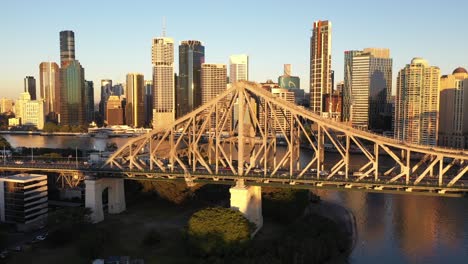 Brisbane-city-sunrise-beautiful-aerial-with-CBD,-Brisbane-river,-buildings,-Story-Bridge-and-Howard-Smith-Wharf-Precinct