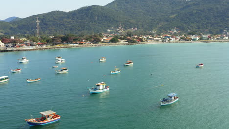 Aerial-view-brazilian-fisherboats,-Praia-Armacao,-Florianopolis,-Santa-Catarina,-Brazil
