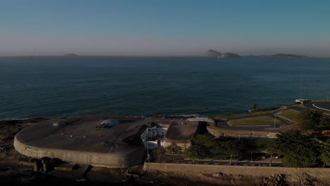 Aerial-tilt-view-on-historic-military-fort-and-museum-of-Copacabana-in-Rio-de-Janeiro-with-the-canon-domes-on-top-of-the-bunker-at-sunrise