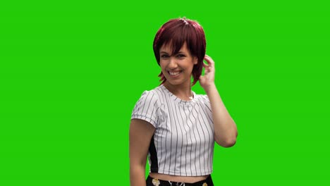 Beautiful-cheerful-woman-adjust-short-hair-on-green-screen