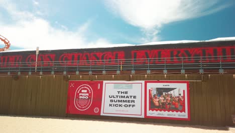 Panning-shot-across-Stranger-Things-Season-3-Slogan-"One-Summer-Can-Change-Everything"-at-the-Stranger-Things-3-Event-Santa-Monica-Pier