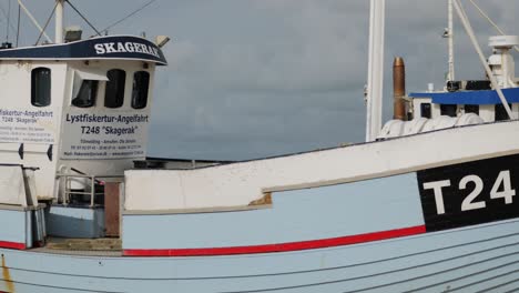 Close-up-of-a-fisherman-boat-at-the-beach-in-summer-with-cloudy-sky