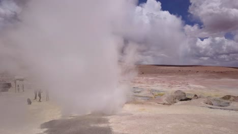 Aerial-flying-into-a-steaming-fumarole-in-Sol-de-Mañana,-a-geothermal-area-in-Bolivia