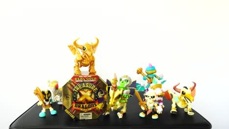 Camera-slowly-zooming-out-to-show-the-Treasure-X-Dragons-Gold-toy-box-with-mini-figures-surrounding-it