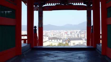 Beautiful-views-from-inside-a-shrine-out-into-the-city-in-Kyoto,-Japan-soft-lighting-slow-motion-4K