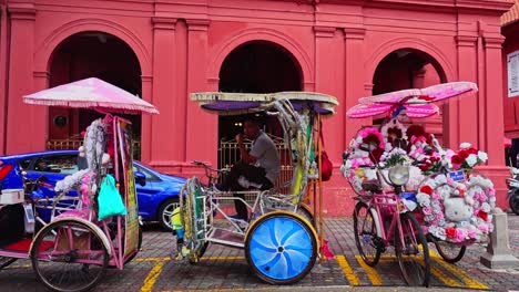 Beautifully-decorated-bicycle-sidecars-in-Melaka-made-from-recycled-materials---wide-pan-shot