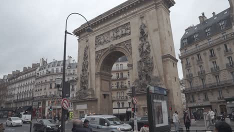 Cars-and-traffic-in-front-of-one-of-the-arches-or-arcs-in-Paris