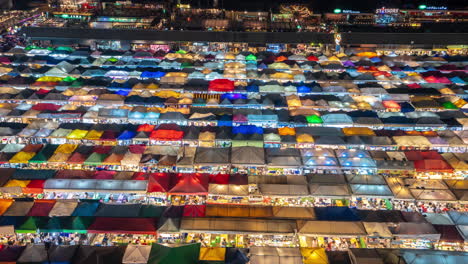 Bangkok,-Thailand,-Timelapse-of-Colorful-Train-Ratchada-Night-Market-and-Traditional-Shops