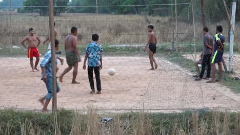 Medium-Exterior-Static-Shot-of-Men-Playing-Volleyball-in-the-Day