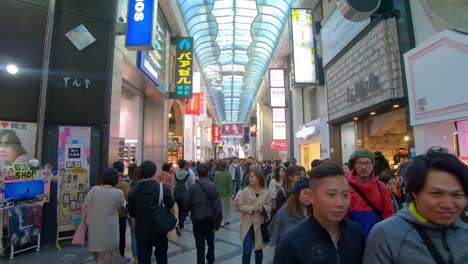 Tourists-sightseeing-and-walking-down-Shinsaibashi-Suji-Shopping-Street