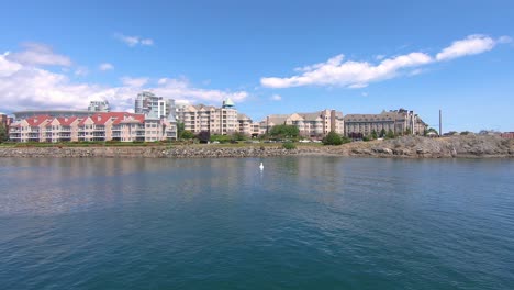 Look-to-a-coast-of-Victoria-city-with-buildings-from-the-sailing-boat