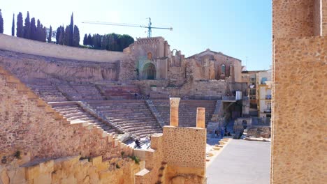 Tilt-up-shot-of-the-Roman-amphiteather-in-Cartagena,-Spain