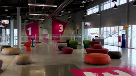 Waiting-area-with-comfy-chairs-at-gate-of-Toulouse-airport-in-Blagnac,-France