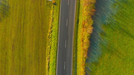 drone-flight-over-open-country-road-with-some-traffic