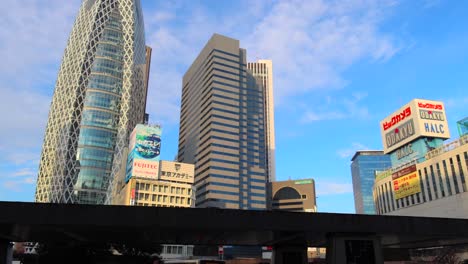Mode-Gakuen-Cocoon-Tower-in-Shinjuku-Tokyo-Japan,-4K-panning-left