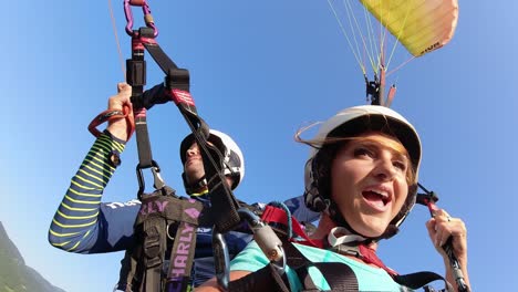 Young-Adult-Woman-Enjoying-Tandem-Paragliding-Flight-Over-Slovenia