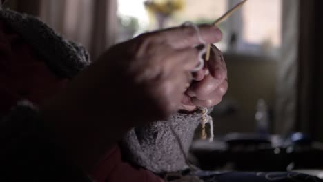 Elderly-lady's-hands-at-home-knitting-medium-shot