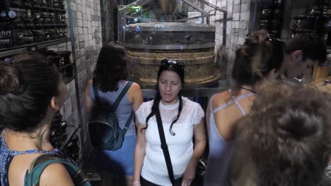 Customers-inside-small-halva-product-shop,-local-delights-manufacture,-Jerusalem