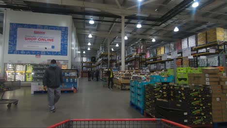 POV-From-Moving-Shopping-Trolly-Through-Fruit-And-Vegetables-At-Costco