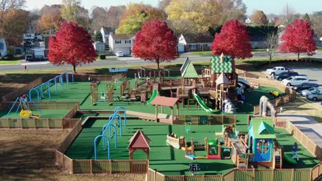 Aerial-of-children-and-families-playing-at-public-park-playground