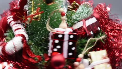 Various-Christmas-decorations-spinning-clockwise-on-grey-background
