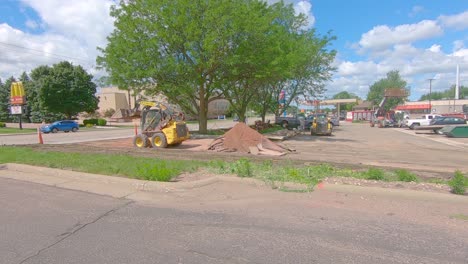 Skid-steer-loader-compacting-the-base-for-a-new-entrance-to-a-parking-lot