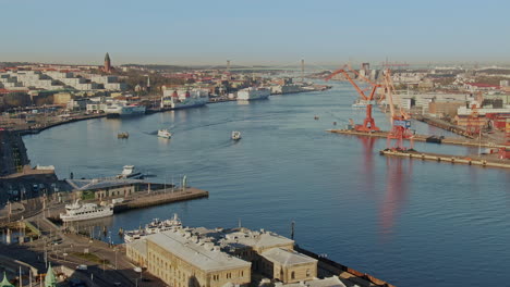 Rising-aerial-orbit-over-docks-in-Gothenburg-Sweden-on-sunny-morning