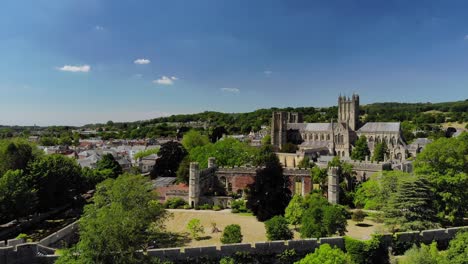 Aerial-view-of-Wells-Cathedral-and-the-moat-in-Bishops-Palace,-Somerset