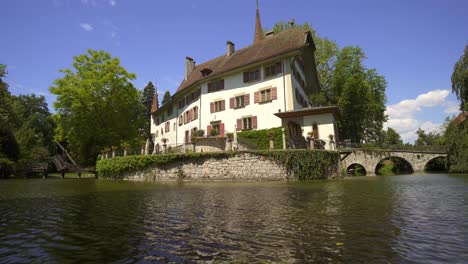 Low-angle-shot-of-famous-water-castle-during-beautiful-day-with-blue-sky