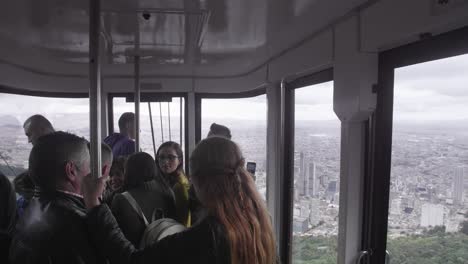 People-inside-an-aerial-cable-car-commuting-to-the-top