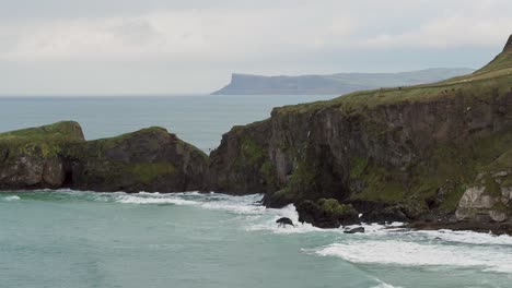 Carrick-a-Rede-Rope-Bridge,-part-of-the-Causeway-Coastal-Route-on-the-north-coast-of-Northern-Ireland