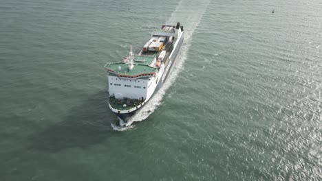 Seatruck-Ferry-Loaded-With-Cargo-Containers-Sailing-On-The-Calm-Irish-Sea-Heading-To-Dublin-Port,-Ireland---aerial-slow-motion