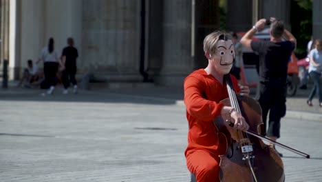 Street-Performer-in-Mask-Costume-in-Berlin-Public-Plaza,-Slow-Motion