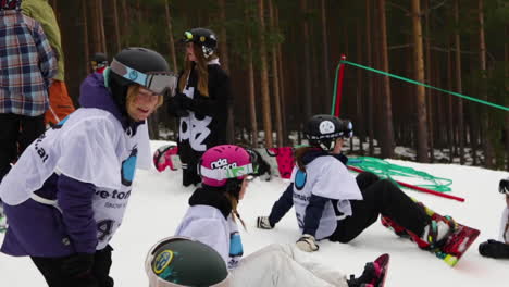 Slowmotion-Shot-of-Snowboarding-Girls-at-a-Competition-in-Sweden