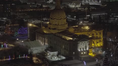 2-2-Aerial-hold-over-Canadian-Governement-Lesgislature-building-at-Christmas-nite-restoration-LED-lit-lights-trees-tents-celebration-quiet-lockdown-restriction-people-gathered-ignoring-pandemic-laws