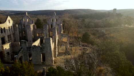 Beautiful-Serene-Scene-of-Ancient-Castle-Ruins-with-Morning-Sun-Rays,-Aerial