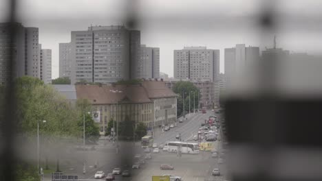 SLOW-MOTION:-Old-apartment-blocks-of-Berlin-shot-through-lattice,-Germany