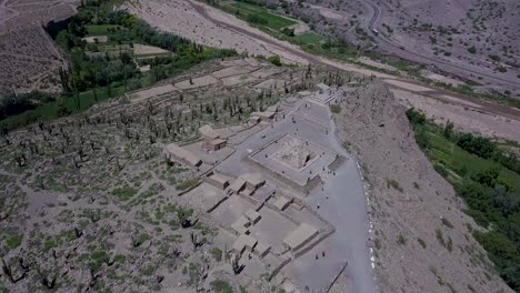 Aerial-view-over-the-Pucará-de-Tilcara,-a-pre-Inca-fortification-outside-the-small-town-of-Tilcara-in-Argentina