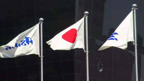 Japan-flag-waving-in-against-clean-blue-sky