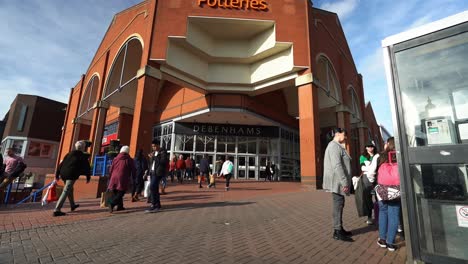 People-shopping,-walking-outside-the-Intu-Potteries-Shopping-Centre-in-Hanley-city-centre-the-main-mall,-precinct