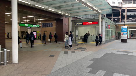 People-climbing-and-descending-stairway-at-Central-gate-of-Akihabara-Station