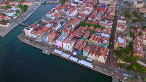 Colorful-colonial-architecture,-aerial-view-of-Willemstad-in-Curacao,-historic-buildings-and-picturesque-waterfront