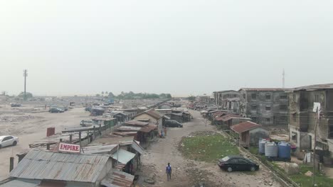 Aerial-shot-of-road-in-Jakande-Slums-in-Nigeria,-Africa