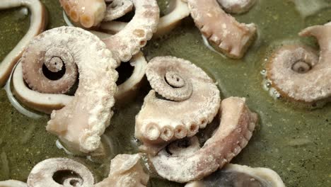 Close-up-of-octopus-being-fried-in-a-pan