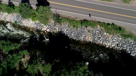Drone-diagonal-pan-over-Highway-34-above-the-Big-Thompson-river-near-Estes-Park-Colorado