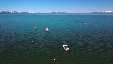 Aerial-shot,-footage-over-Lake-Tahoe-and-boats,-sunny-afternoon,-Nevada