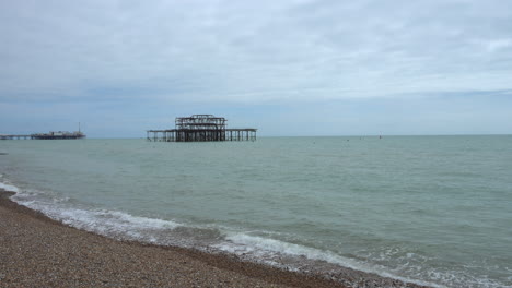Wide-shot-of-the-sea-on-the-south-coast-of-England-with-Brighton-pier-in-the-background